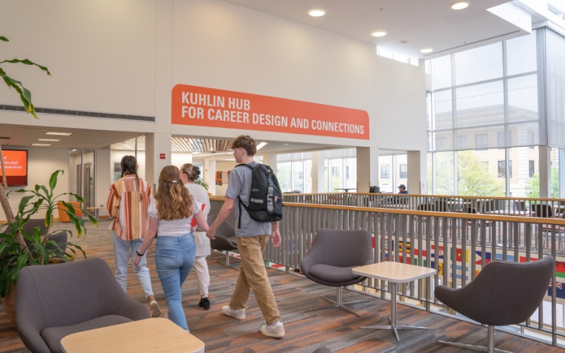 Two students walking through a BGSU building